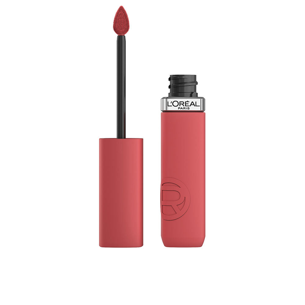 Matte liquid lipstick tube with angled applicator, warm red shade