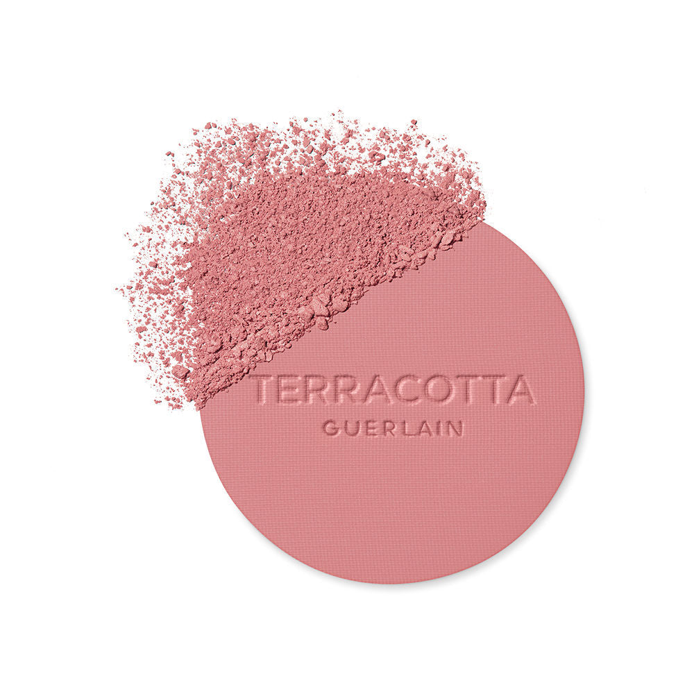 Guerlain Round glossy-lidded plastic compact showing pressed pink and brown powder blush, refined craftsmanship .