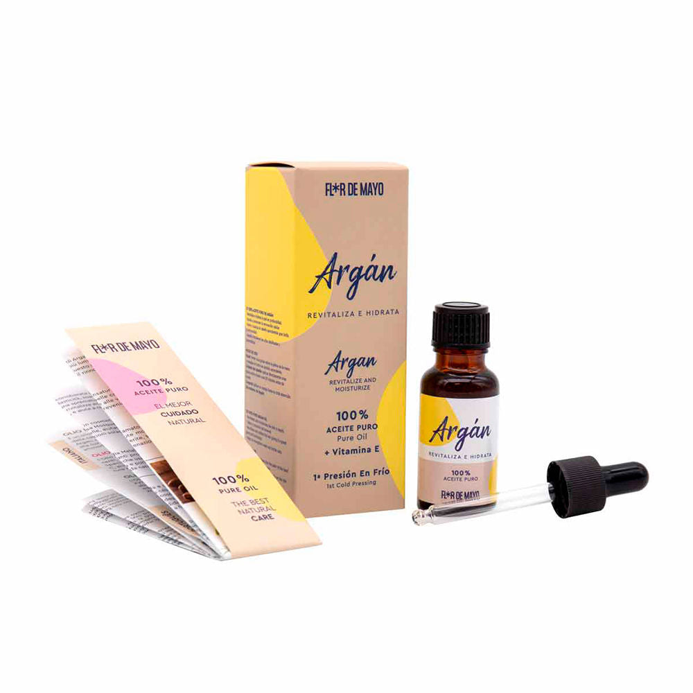 Flor de Mayo Small amber glass bottle with golden oil, black dropper cap beside rectangular box and leaflet