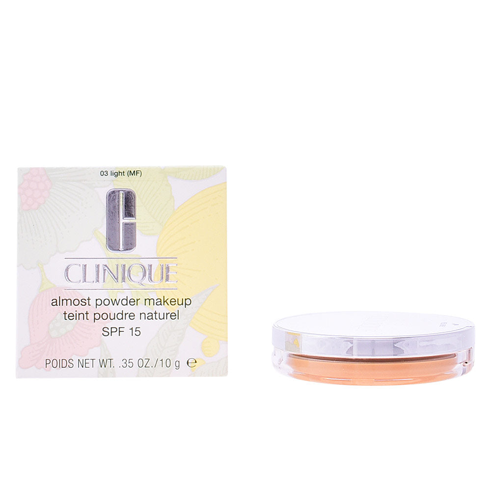 Compact pressed powder foundation in light shade with mini brush, SPF 15