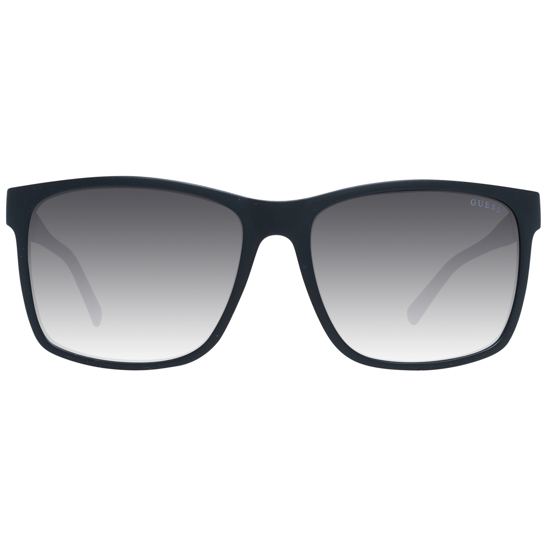 Black rectangular sunglasses on neutral background with gradient lenses and visible logo on temple