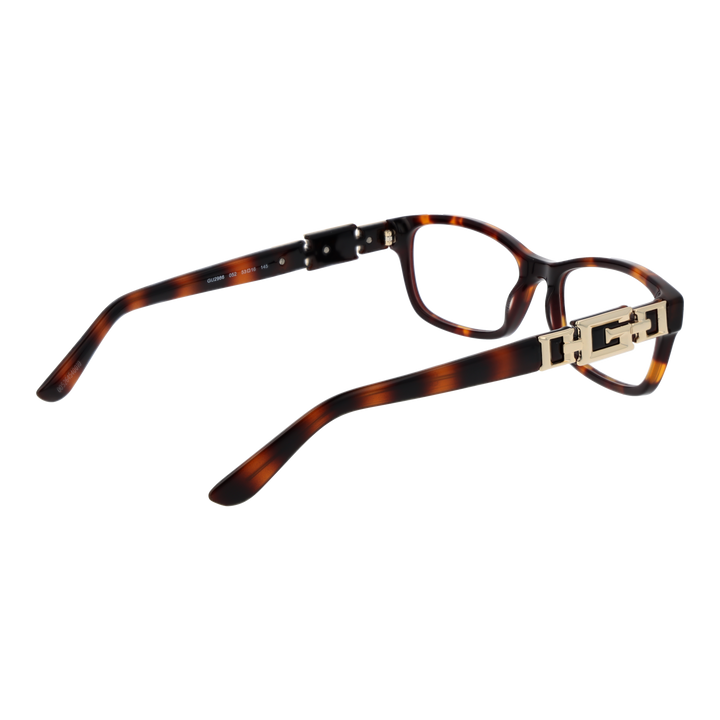 Tortoise shell rectangular eyeglasses for Women with gold temple detail on neutral background