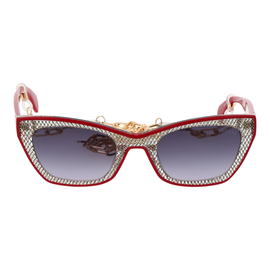 Red and black textured cat-eye sunglasses with gradient grey lenses and decorative gold chain over a neutral background