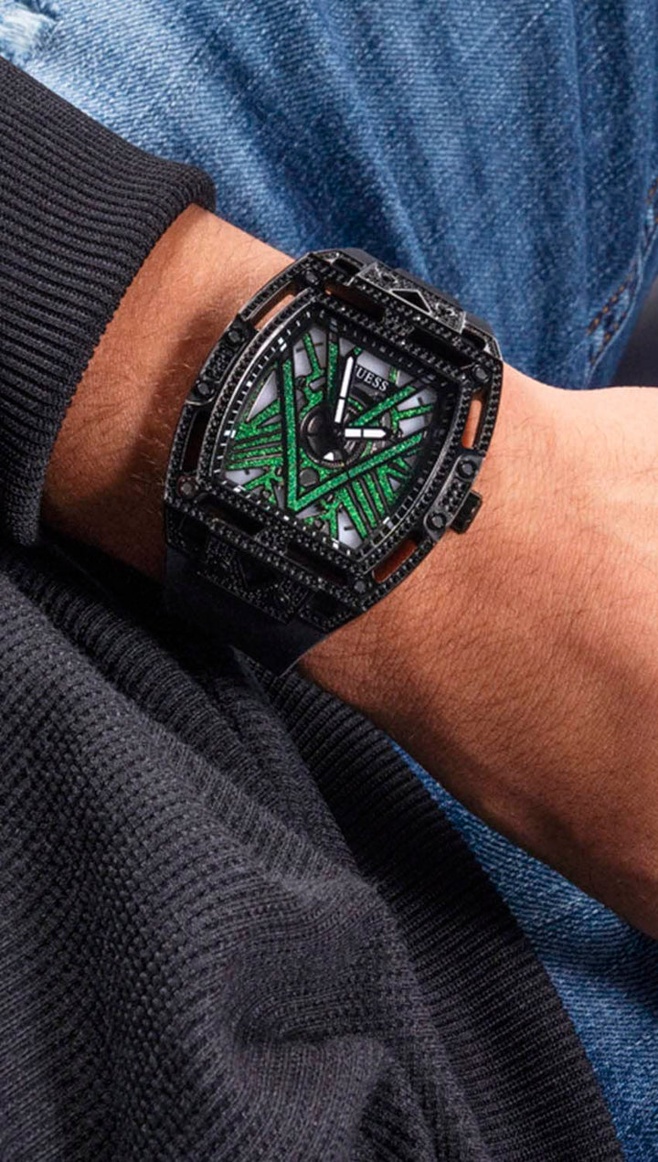 Unisex black watch with crystal-set case, geometric black dial and green accents, silicone strap