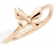Rose gold delicate butterfly ring on neutral background, close-up showing fine band and motif