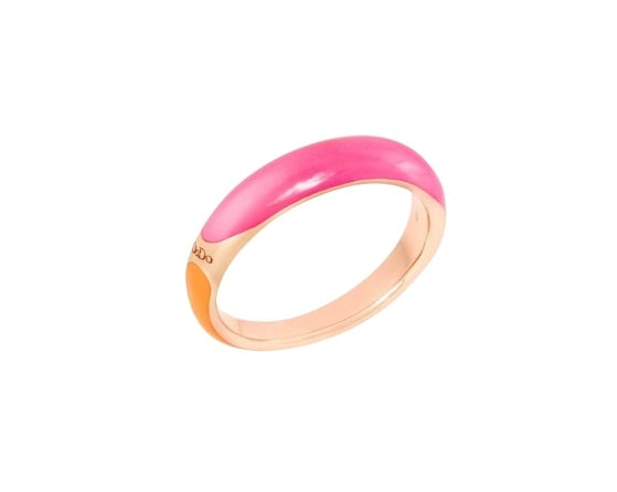 Close-up of rose gold ring with pink and orange enamel bands on a neutral background, modern sculptural profile
